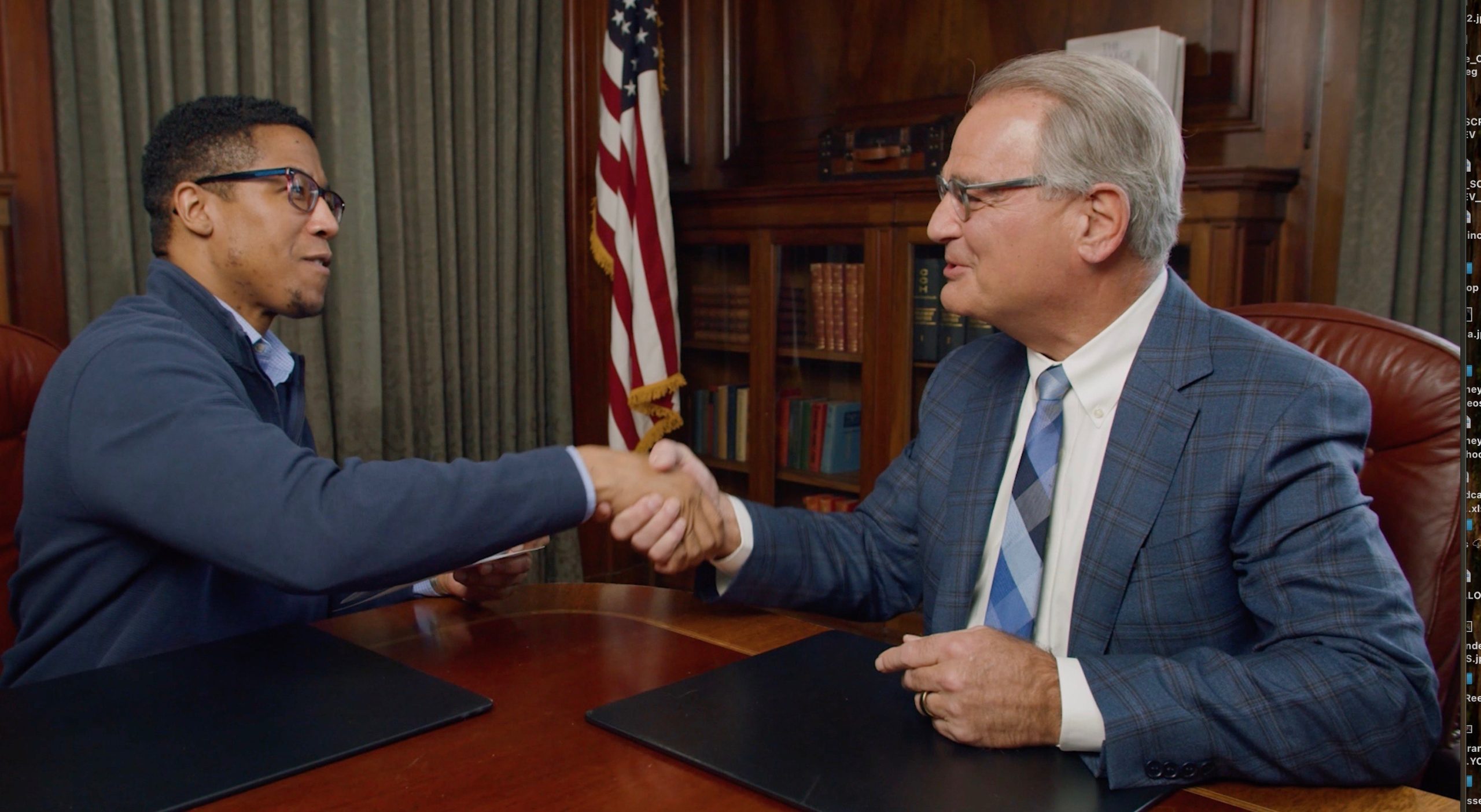 Ross Cellino shaking hands with a client